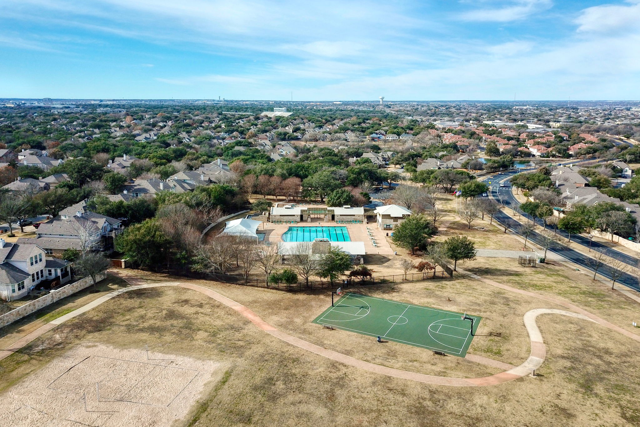 14001 Avery Ranch Boulevard, Unit 602 Austin, TX 78717 - Photo 33 of 39 Aerial perspective of suburban area featuring a pool