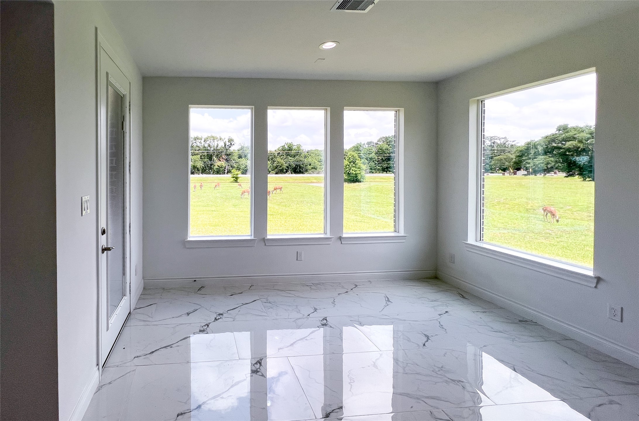 126 Lakeland Circle Rosharon, TX 77583 - Photo 9 of 49 a view of an empty room with a window