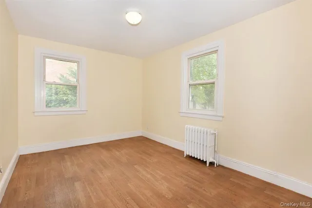 a view of an empty room and a window