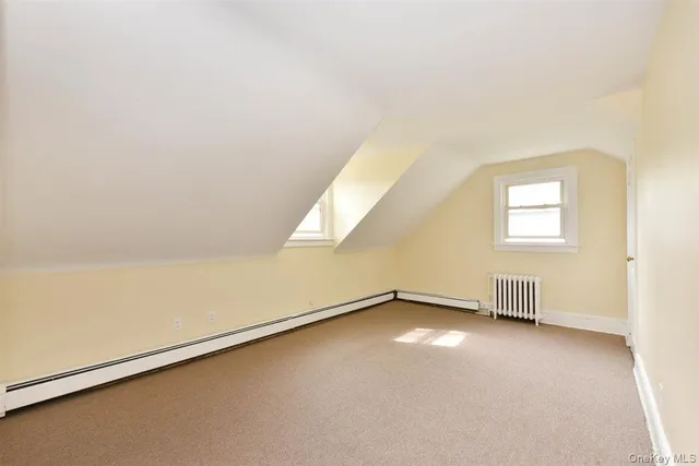 a bath room with a toilet a bath tub and a shower