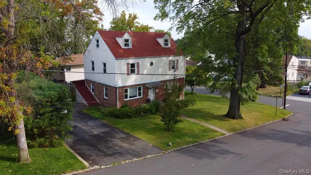 an aerial view of a house with a yard and garden