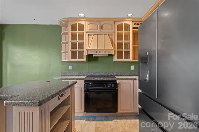 a kitchen with a stove and a sink