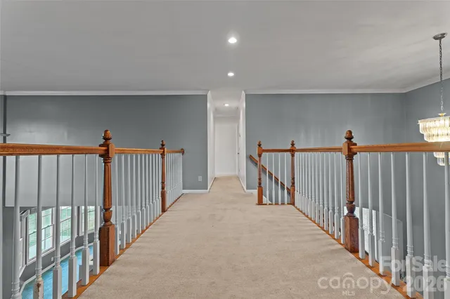a view of a hallway with a stairs