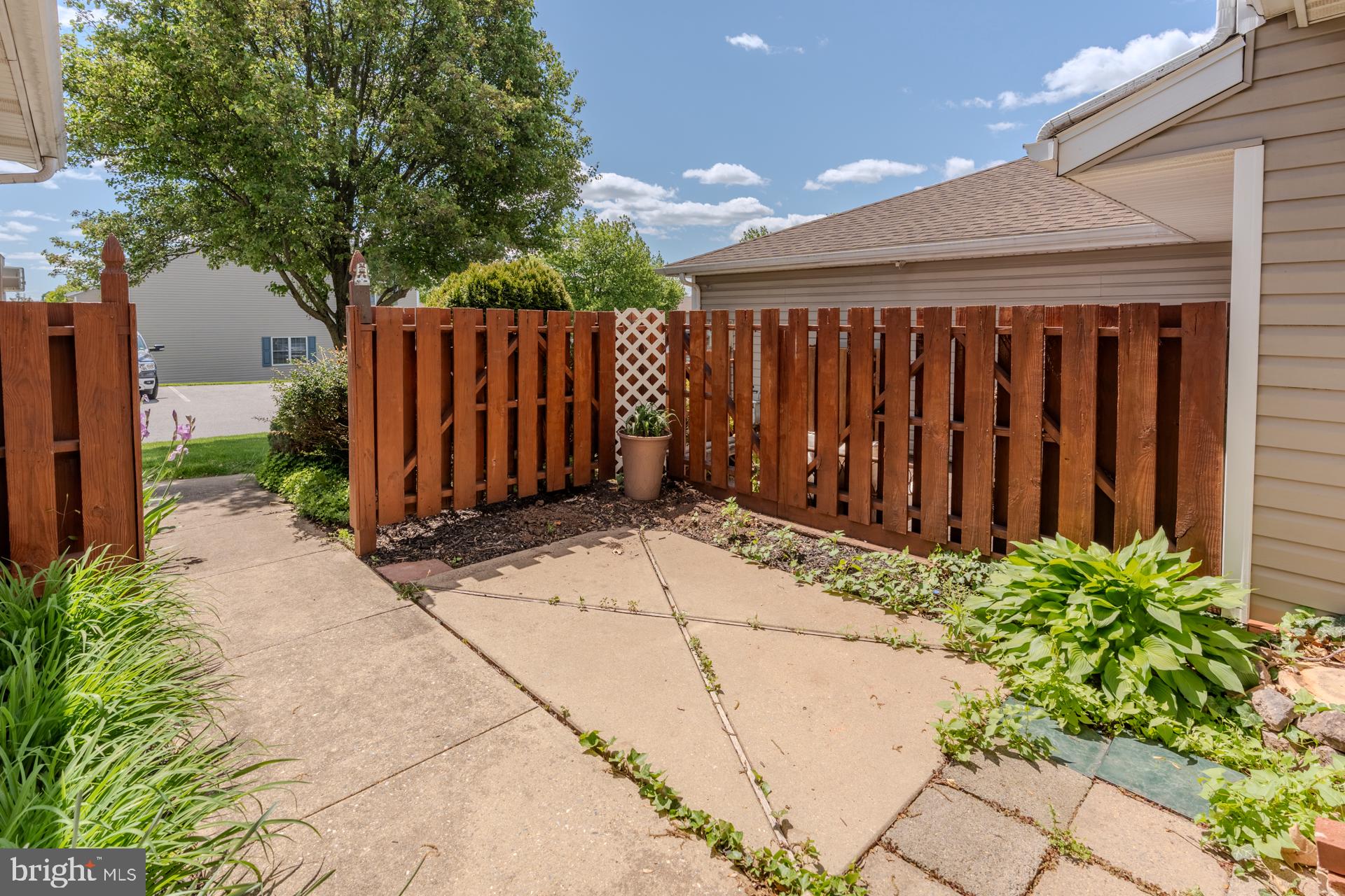 305 Stonegate Road York, PA 17408 - Photo 4 of 38 Charming garden path with wooden fence.