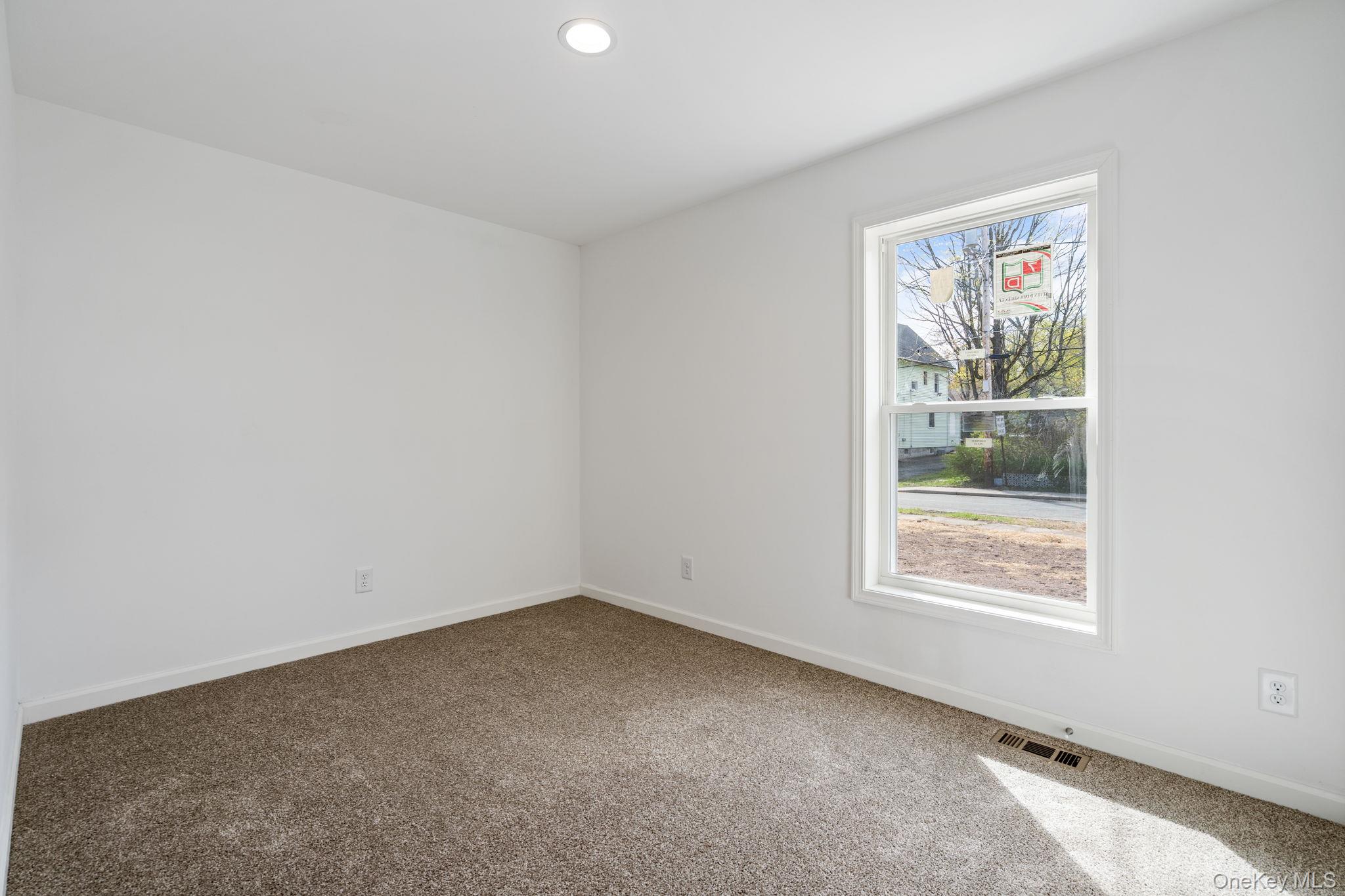 23 Spring Street Monticello, NY 12701 - Photo 17 of 44 an empty room with a window
