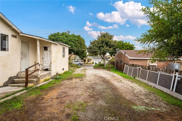a view of a park with large trees