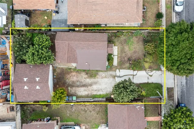 an aerial view of a building with parking space