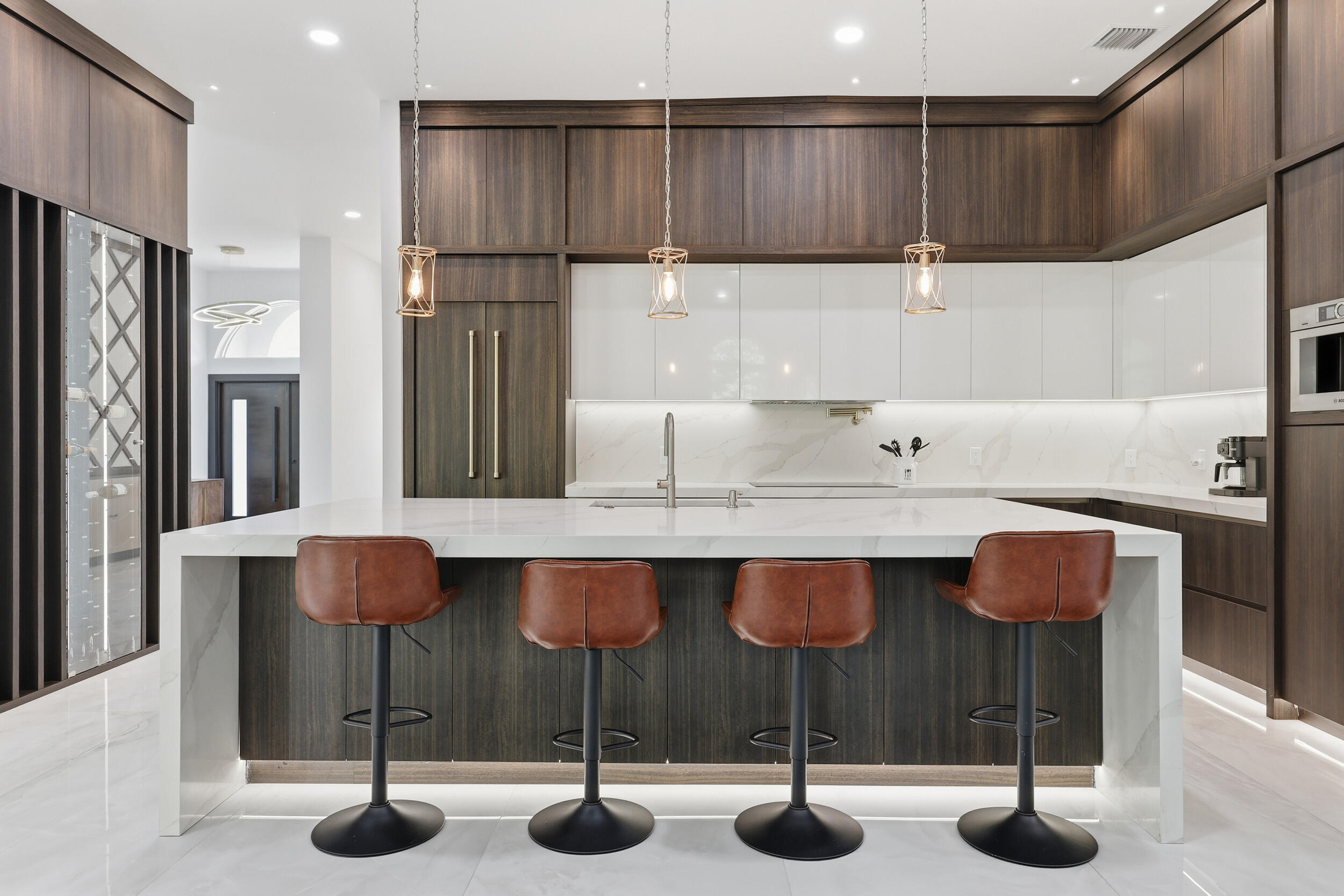 12363 Clearfalls Drive Boca Raton, FL 33428 - Photo 14 of 58 a kitchen with cabinets and chairs