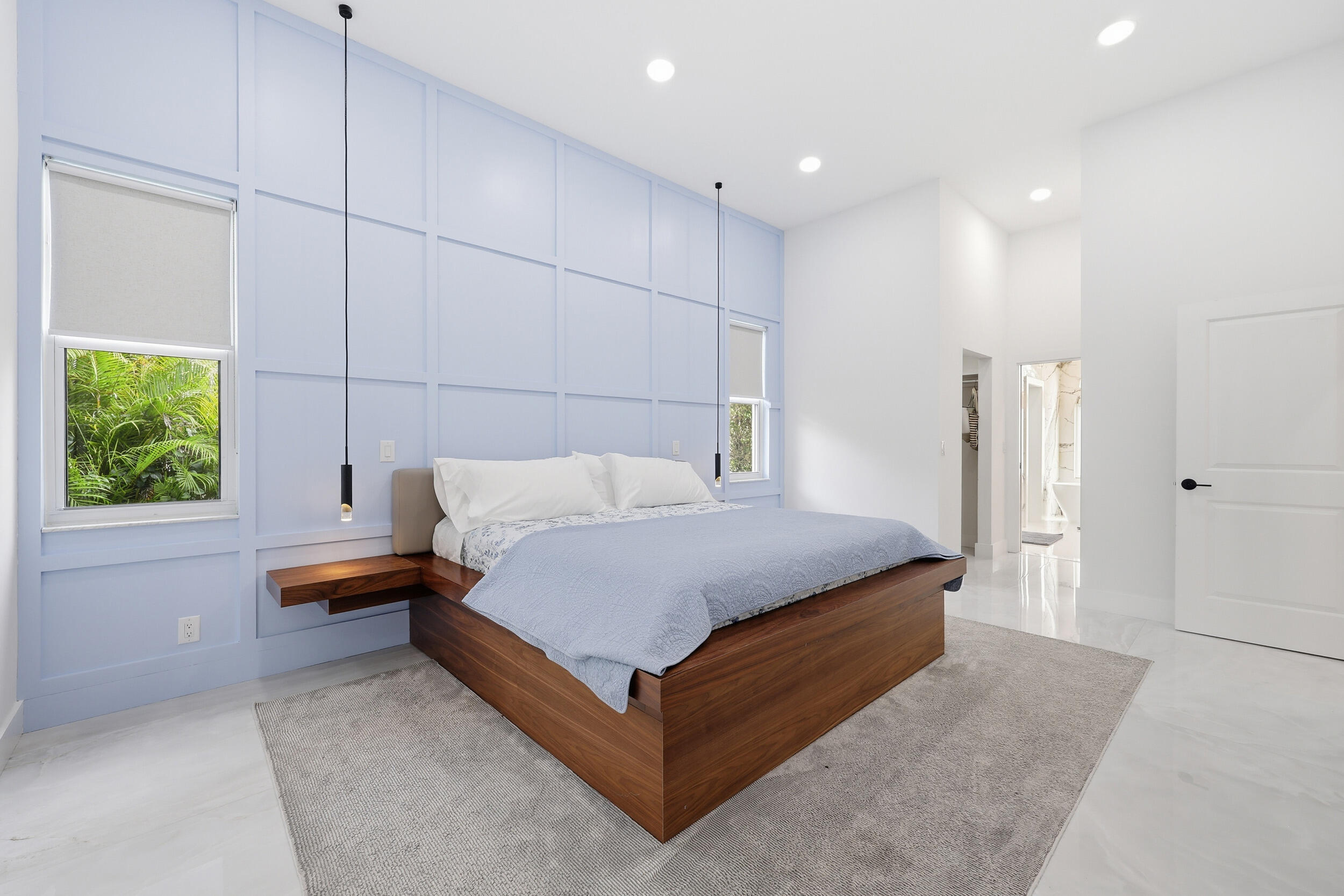 12363 Clearfalls Drive Boca Raton, FL 33428 - Photo 18 of 58 a bedroom with a bed and a window