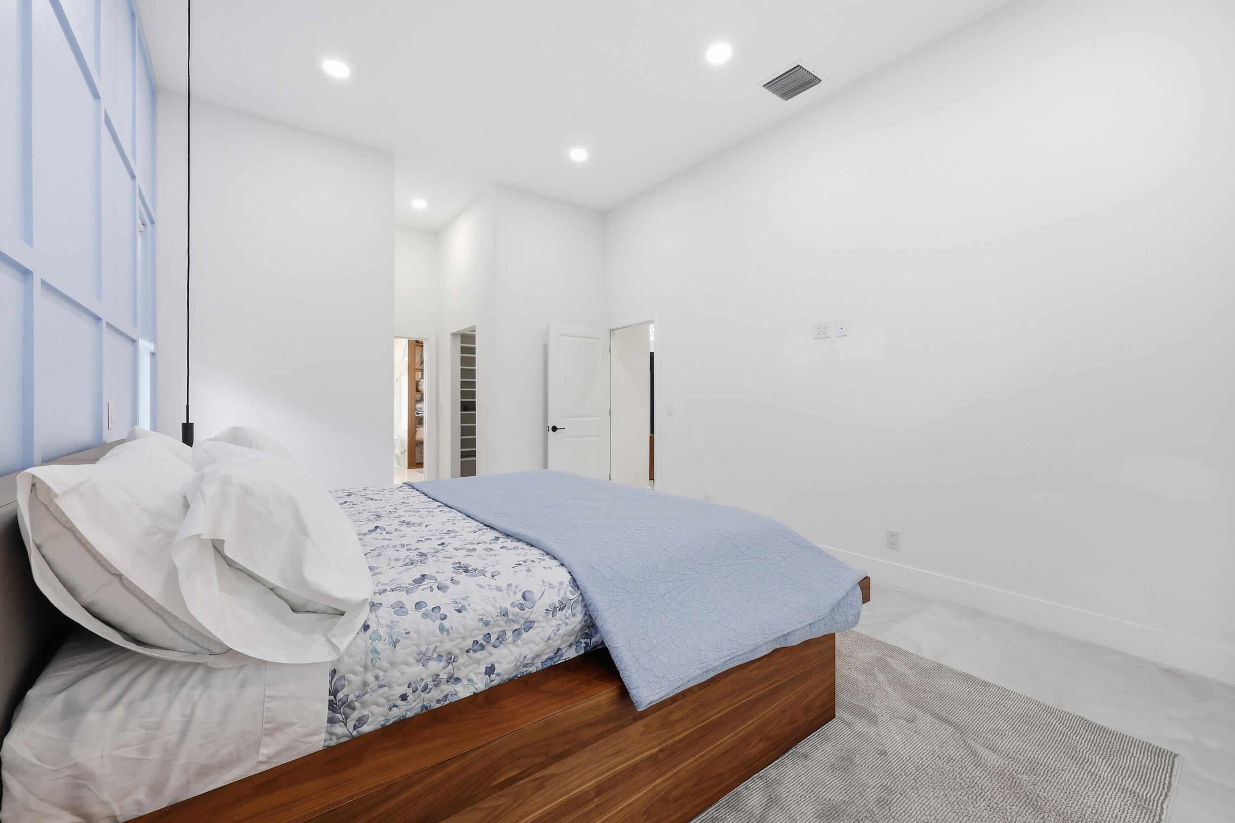 12363 Clearfalls Drive Boca Raton, FL 33428 - Photo 20 of 58 a bedroom with a bed and a dresser