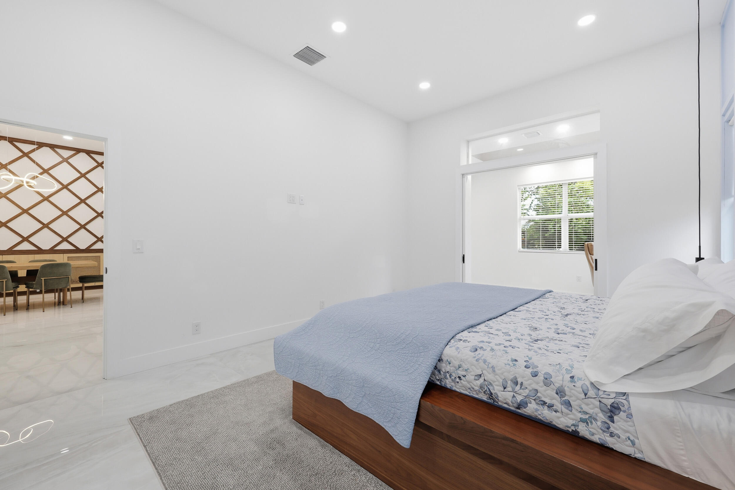 12363 Clearfalls Drive Boca Raton, FL 33428 - Photo 23 of 58 a bedroom with a bed and a couch