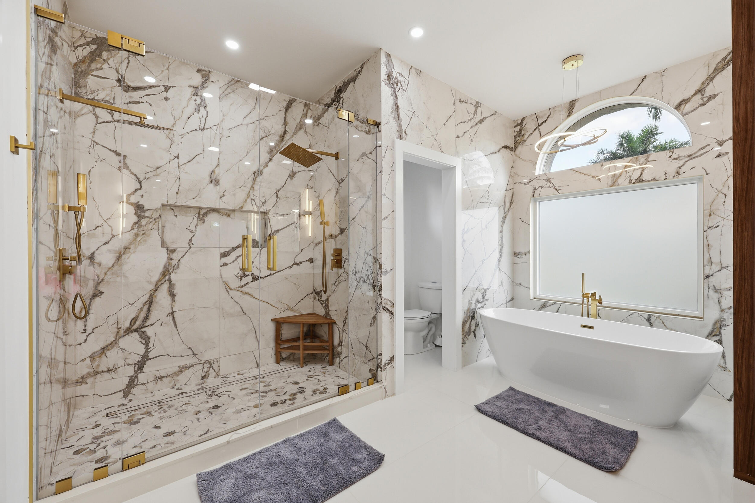 12363 Clearfalls Drive Boca Raton, FL 33428 - Photo 26 of 58 a bathroom with a bathtub sink and mirror