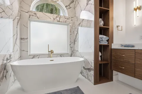 a bedroom with a bed and a table