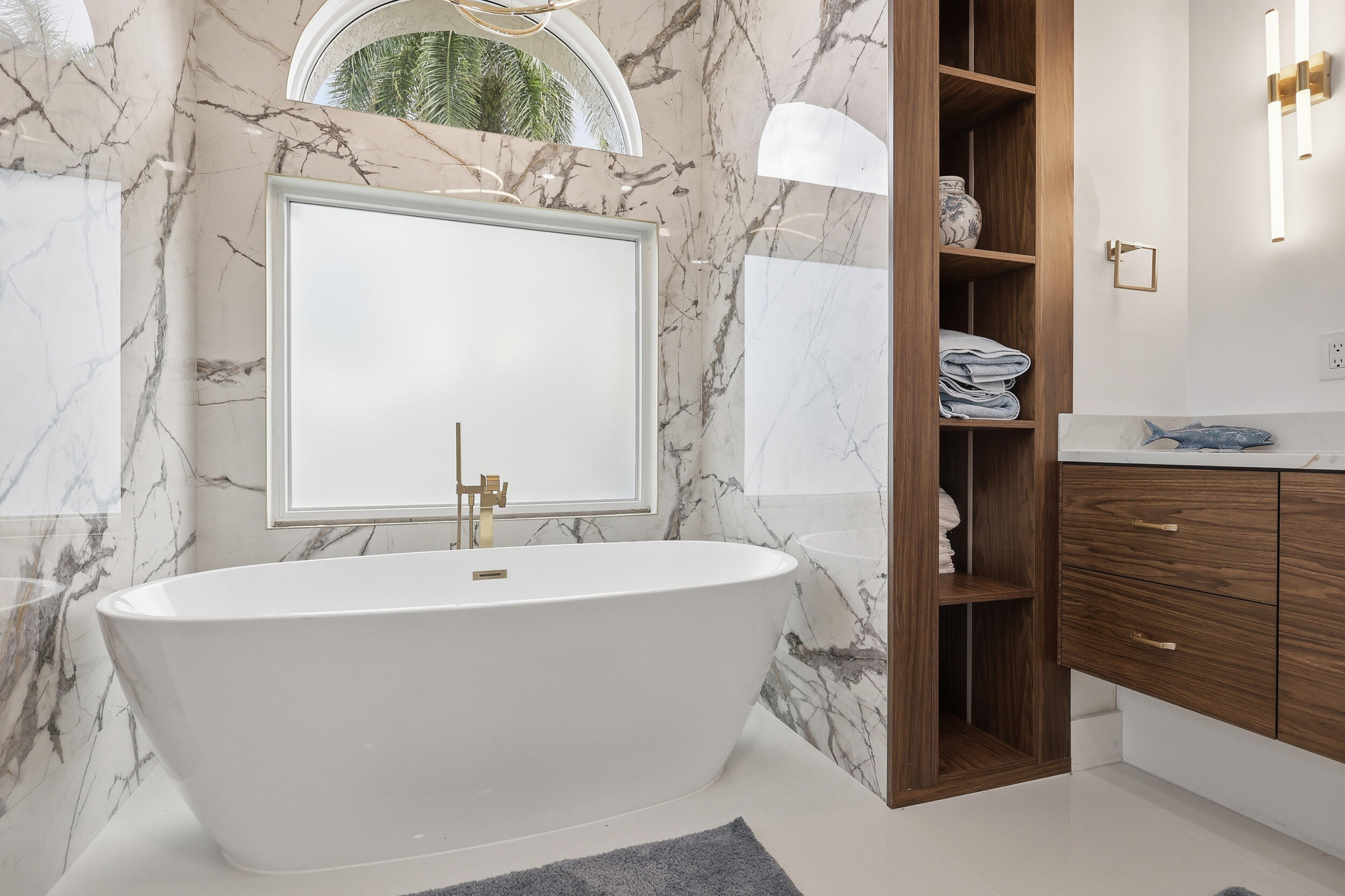 12363 Clearfalls Drive Boca Raton, FL 33428 - Photo 27 of 58 a bath tub sitting next to a bathroom sink