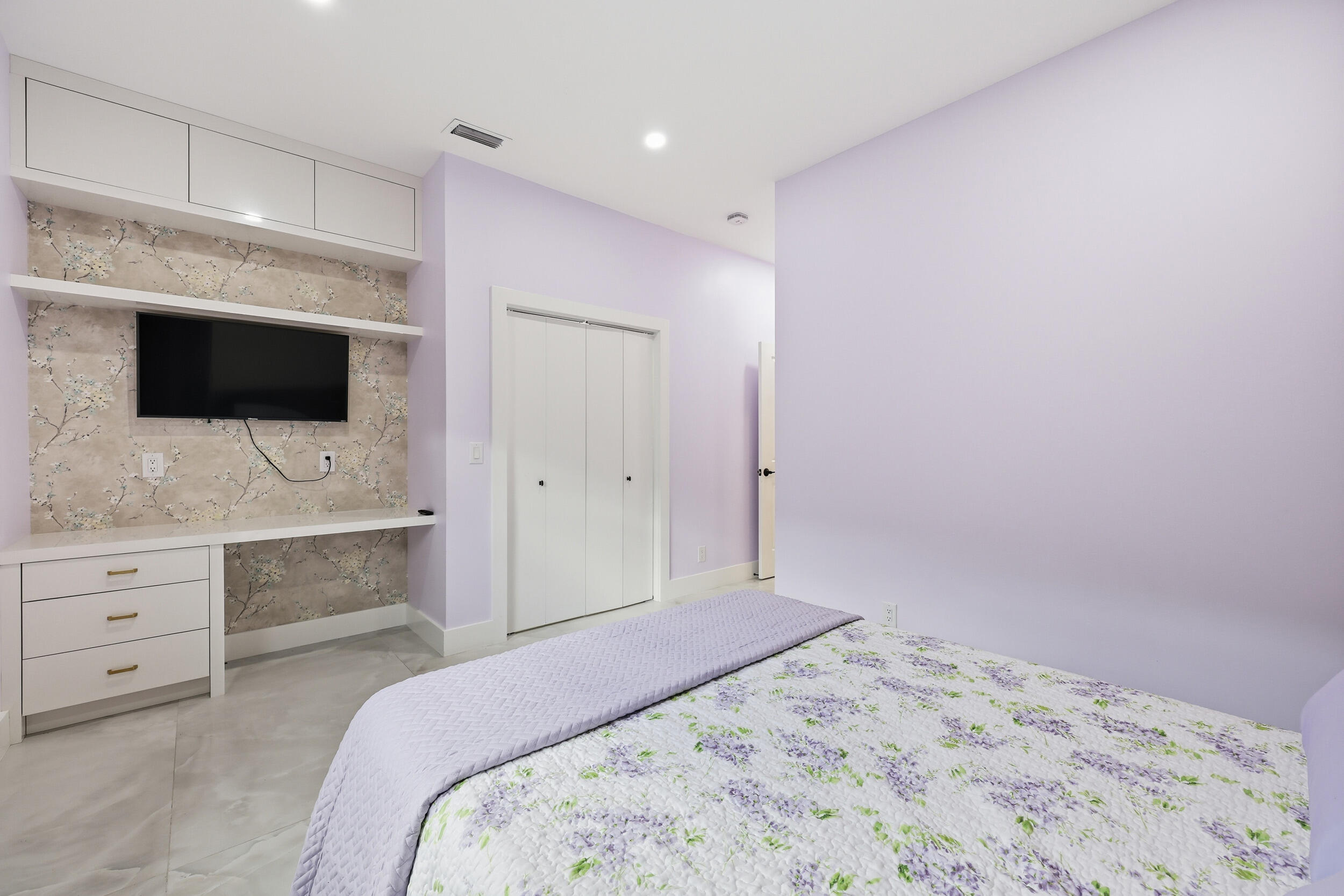 12363 Clearfalls Drive Boca Raton, FL 33428 - Photo 30 of 58 a bedroom with a bed and a flat screen tv