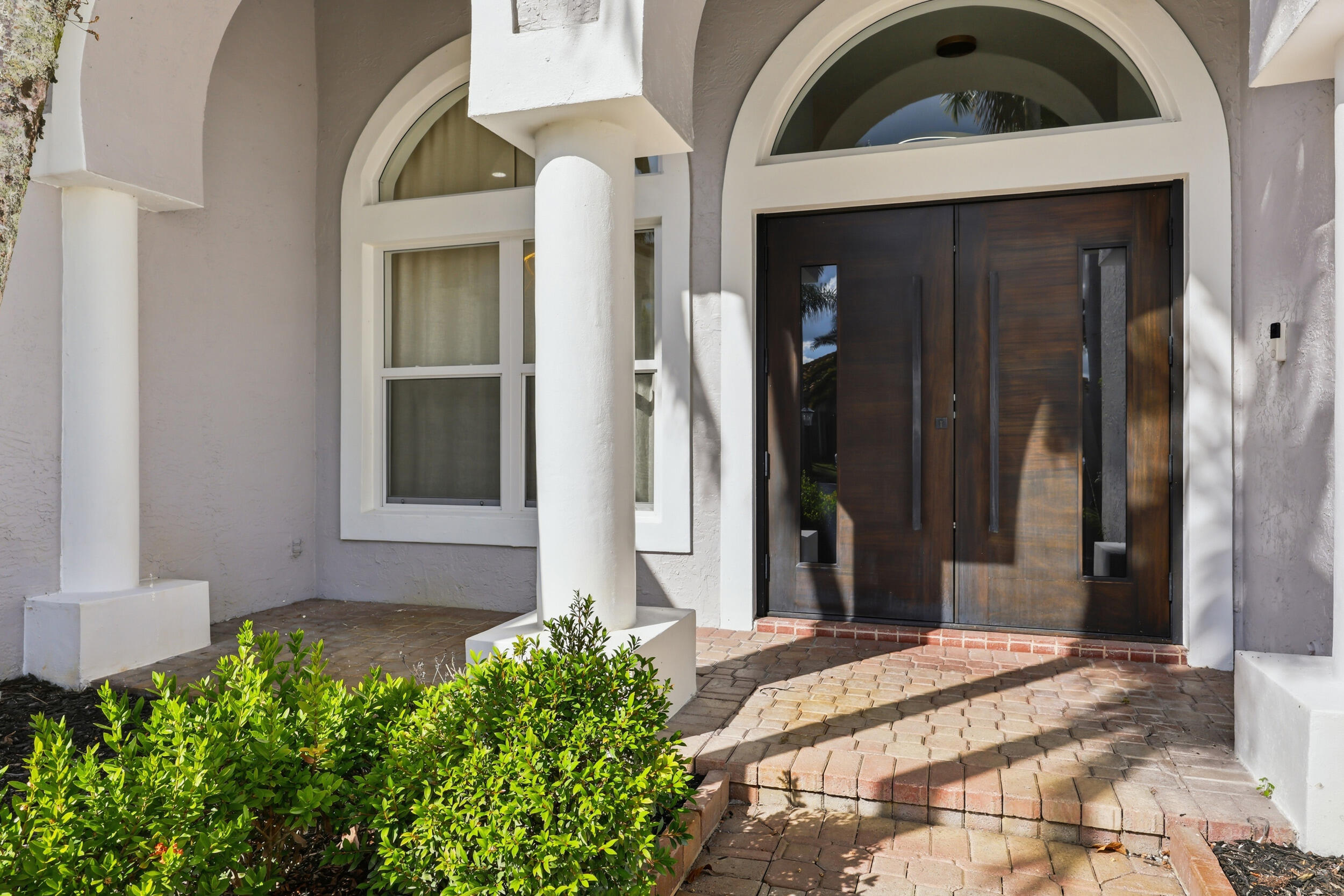 12363 Clearfalls Drive Boca Raton, FL 33428 - Photo 3 of 58 a front view of a house with a yard