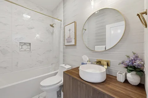 a bedroom with a bed and a couch