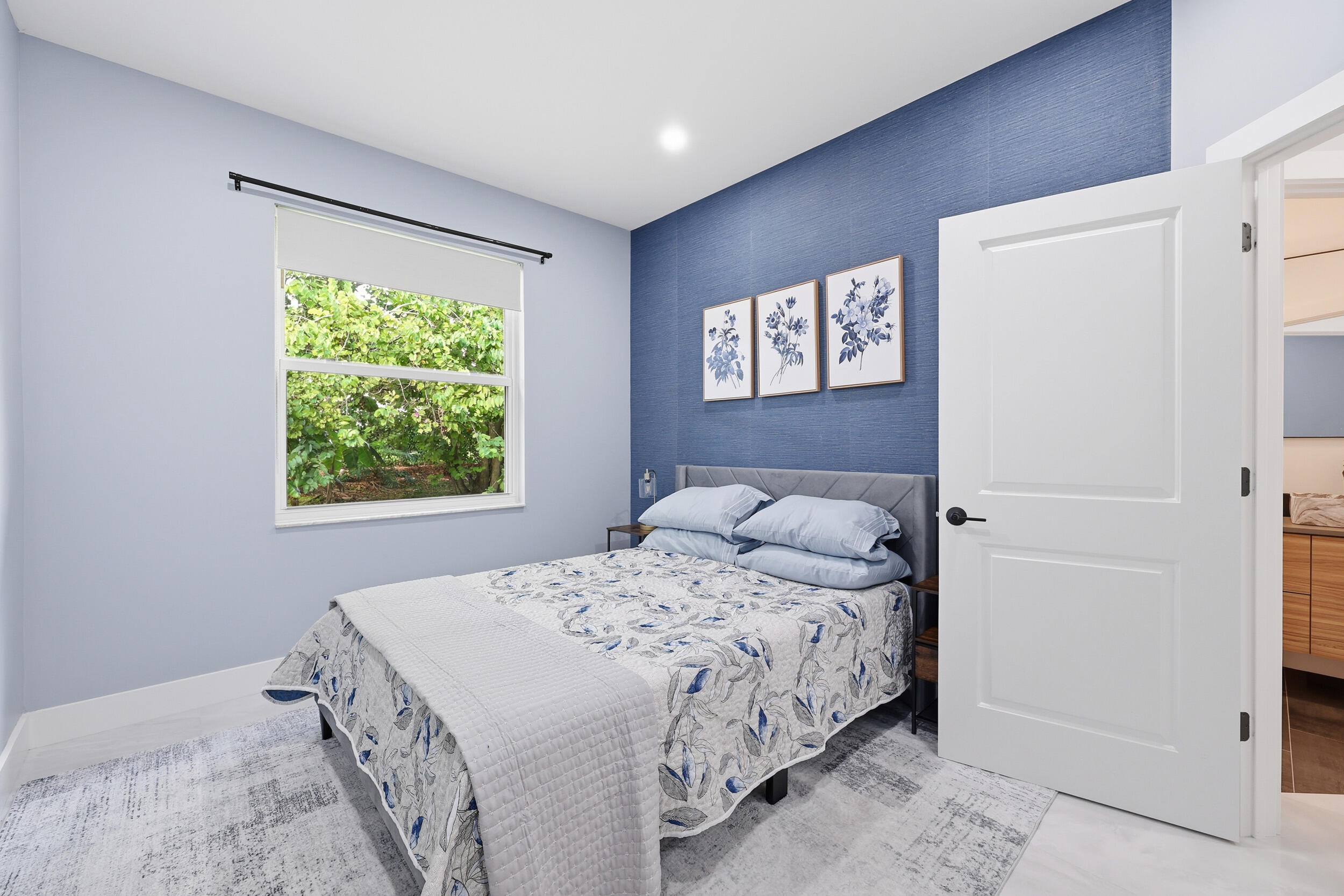 12363 Clearfalls Drive Boca Raton, FL 33428 - Photo 32 of 58 a bedroom with a bed and a window