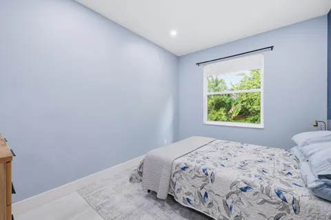 a bathroom with a shower and a sink