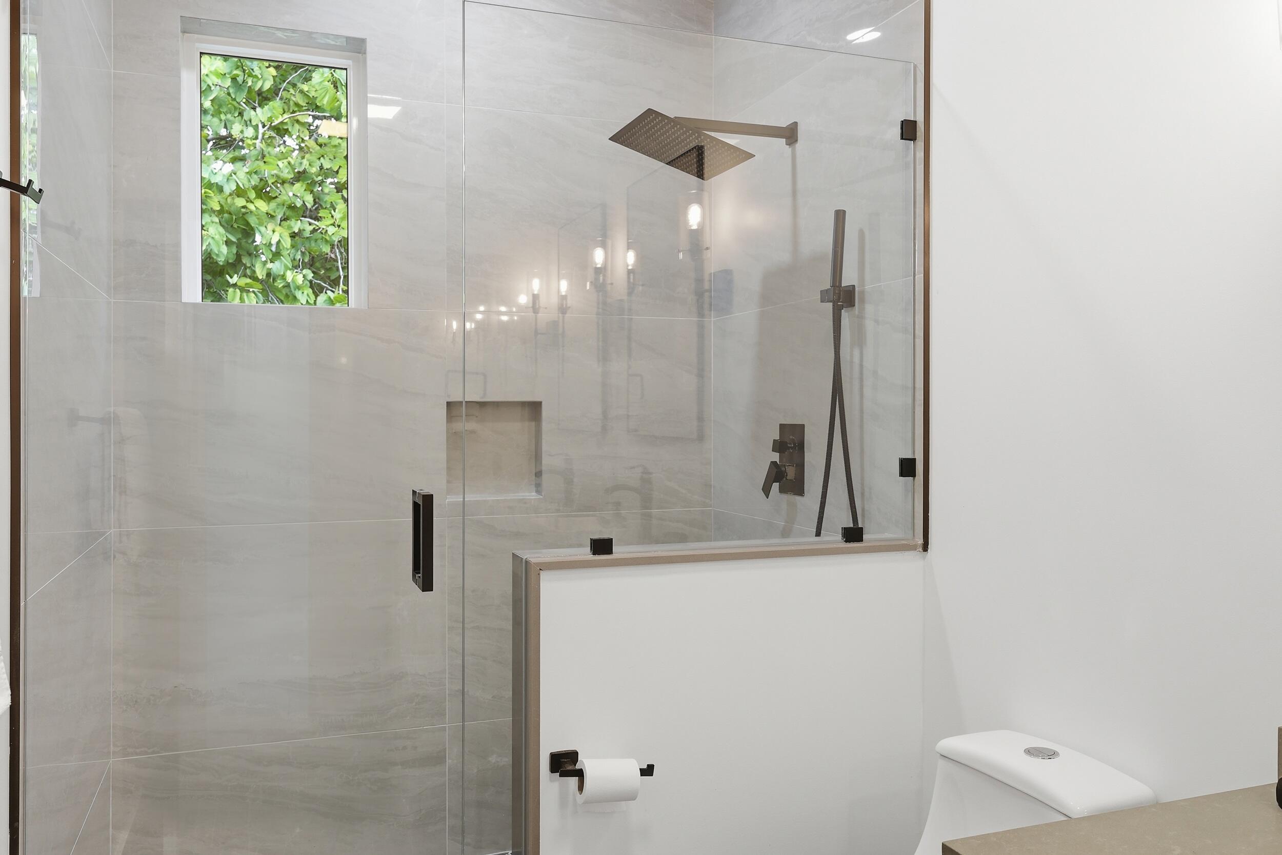 12363 Clearfalls Drive Boca Raton, FL 33428 - Photo 36 of 58 a bathroom with a shower and a sink