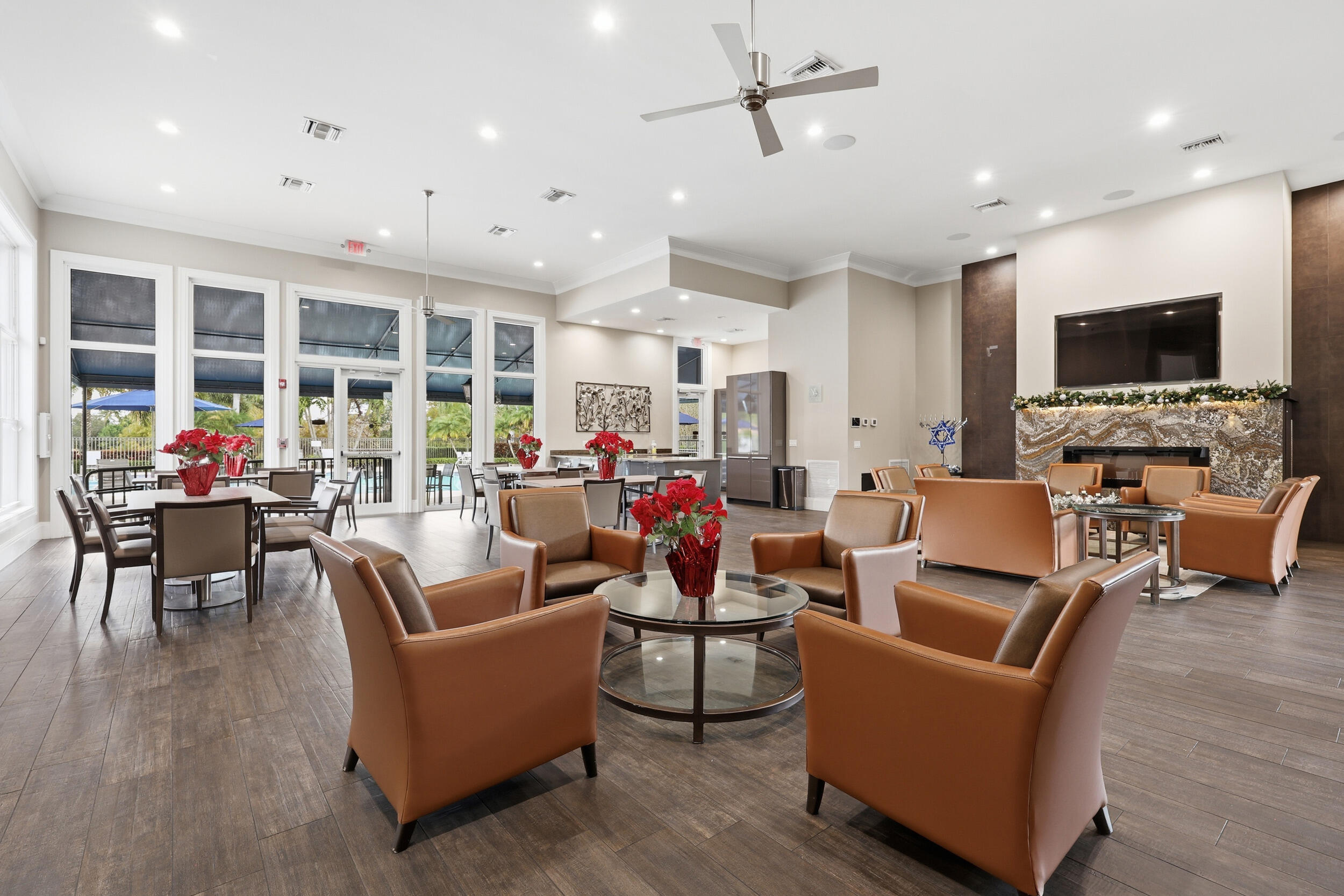 12363 Clearfalls Drive Boca Raton, FL 33428 - Photo 45 of 58 a living room with furniture kitchen area and a flat screen tv