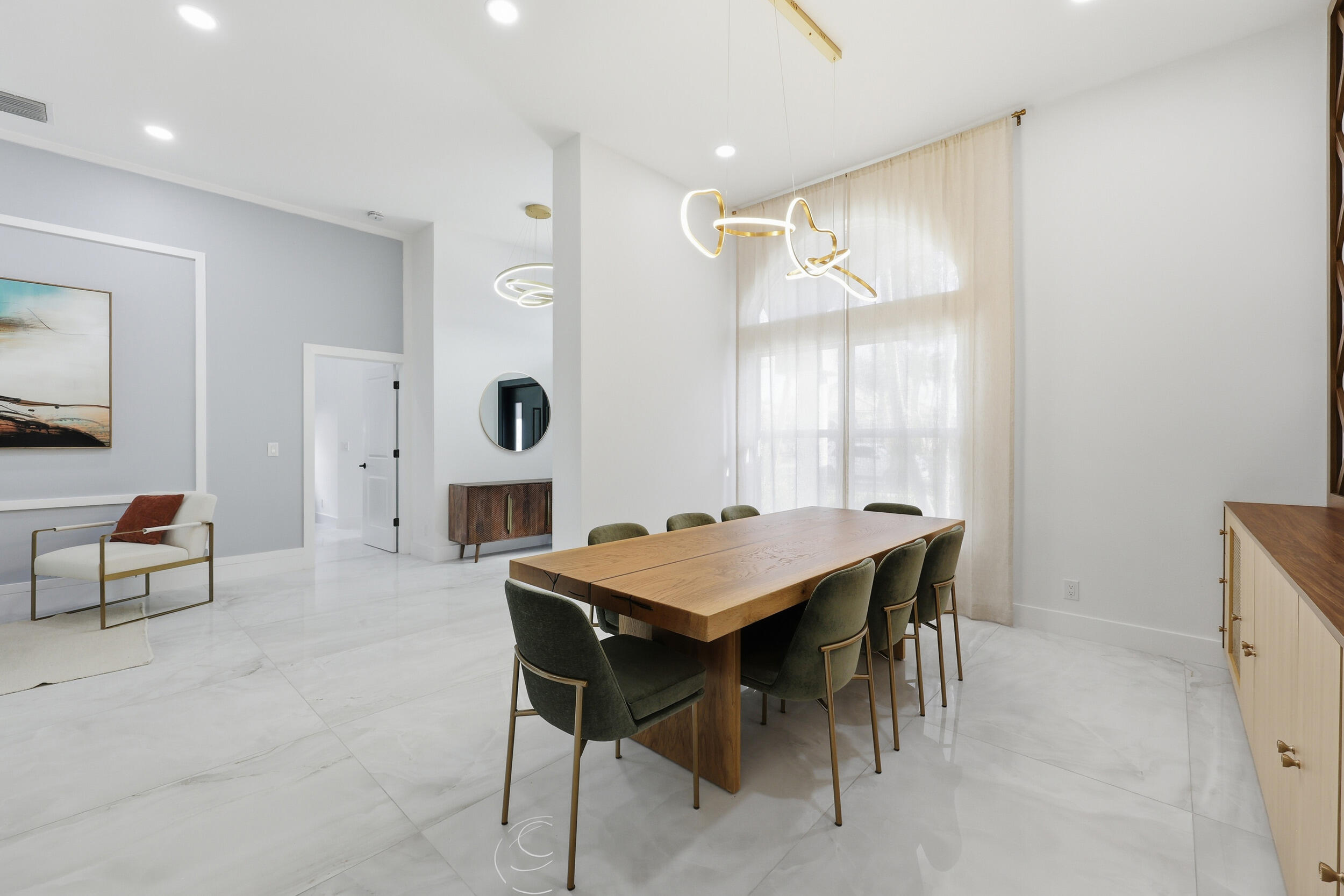 12363 Clearfalls Drive Boca Raton, FL 33428 - Photo 5 of 58 a dining hall with stainless steel appliances kitchen island a table and chairs