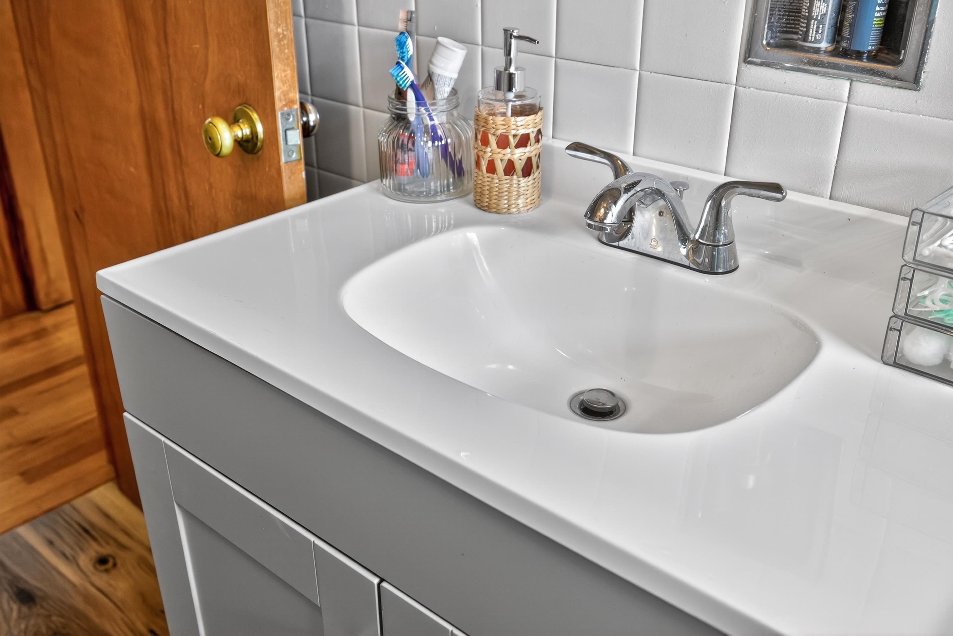 7827 Lee Highway Raphine, VA 24472 - Photo 32 of 62 a bathroom with a sink and a mirror