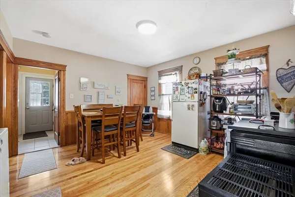 a view of a dining room with furniture window and wooden floor