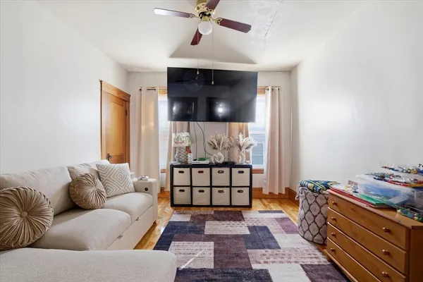 a living room with furniture and a rug