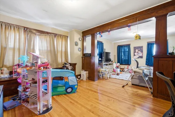 a very nice looking room with a large window and furniture