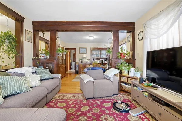 a living room with furniture and a flat screen tv