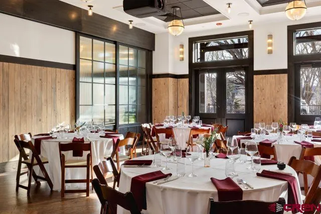a very nice looking living room with furniture and floor to ceiling windows