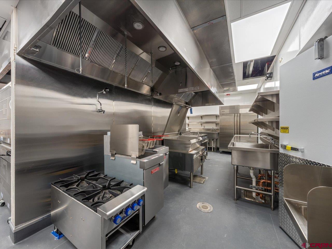 185 North Lena Street Ridgway, CO 81432 - Photo 17 of 20 a kitchen with a stove and a refrigerator
