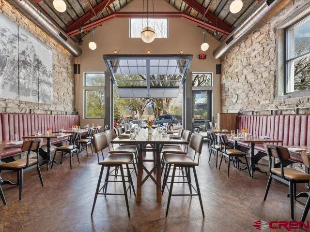 a view of a dining room with furniture window and outdoor view