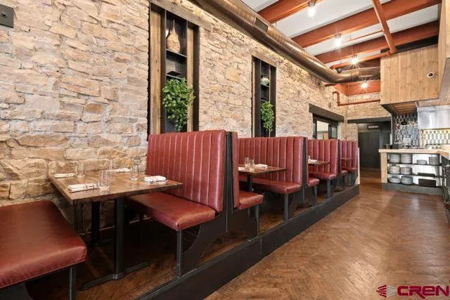 a view of a balcony with furniture