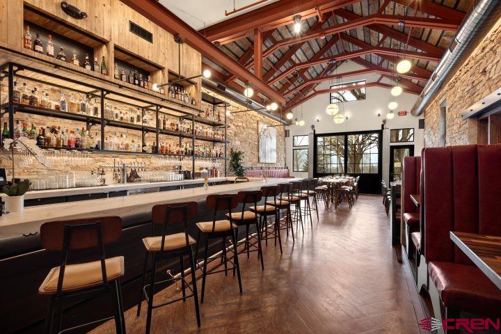 185 North Lena Street Ridgway, CO 81432 - Photo 7 of 20 a dining hall with stainless steel appliances granite countertop a dining table and chairs