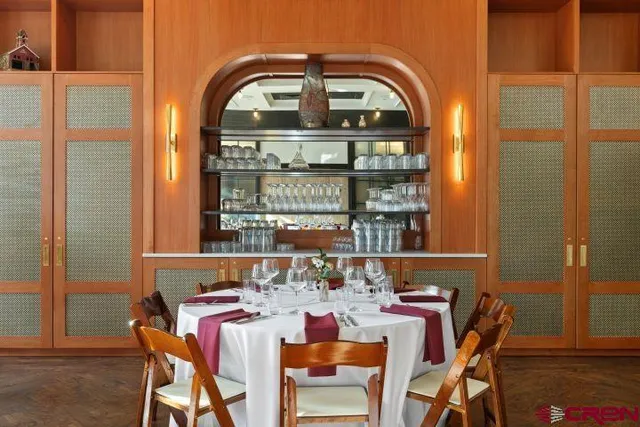 a view of a dining room with furniture and window