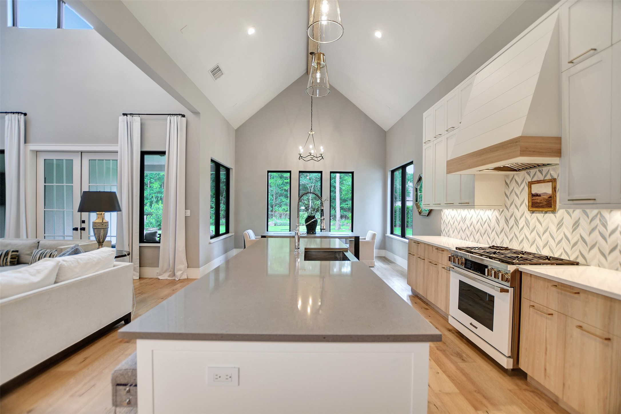 411 Copa Palm Loop Montgomery, TX 77316 - Photo 15 of 46 a large kitchen with stainless steel appliances granite countertop a stove a sink dishwasher and a refrigerator with white cabinets