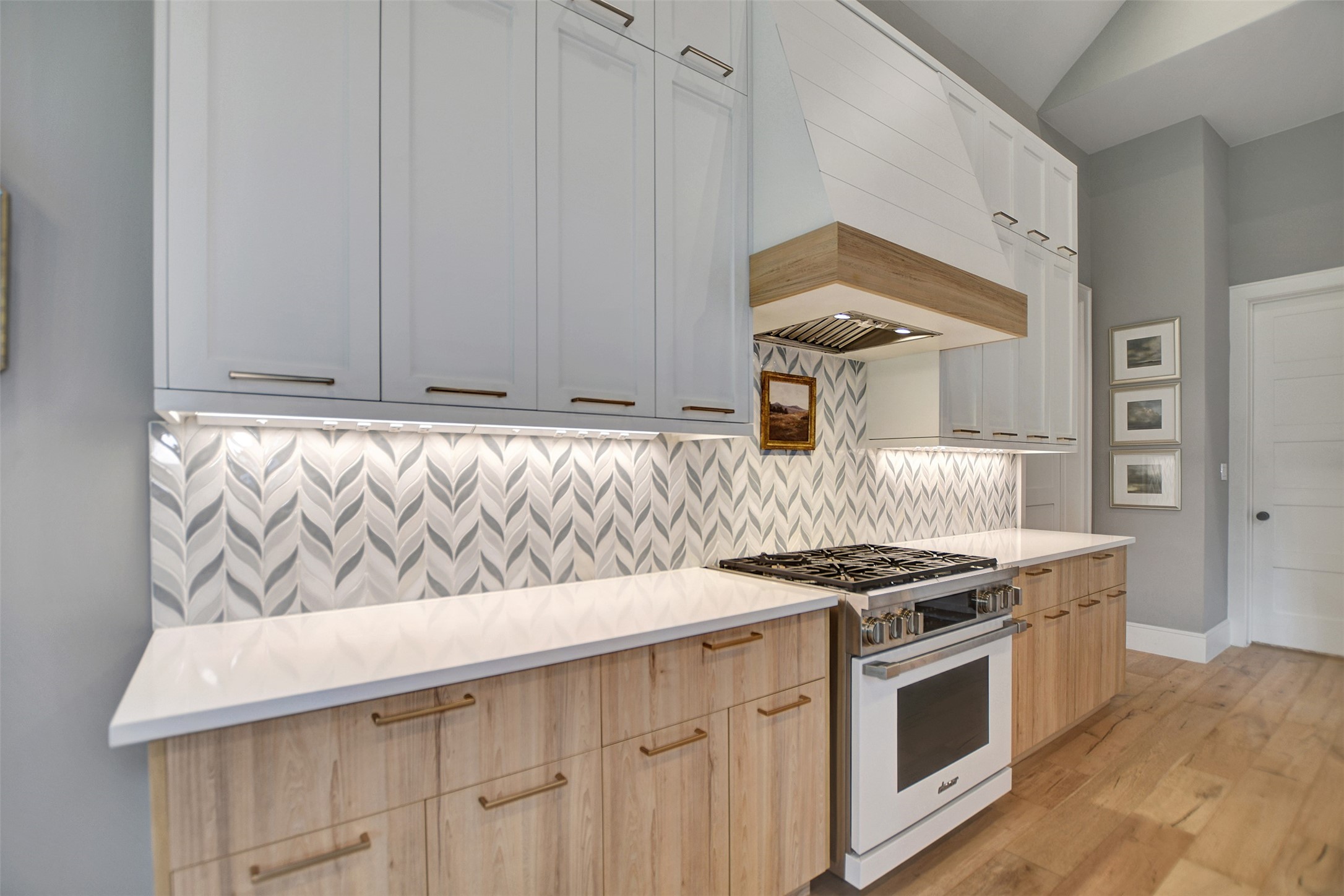 411 Copa Palm Loop Montgomery, TX 77316 - Photo 18 of 46 a kitchen with stainless steel appliances granite countertop a stove and a white cabinets