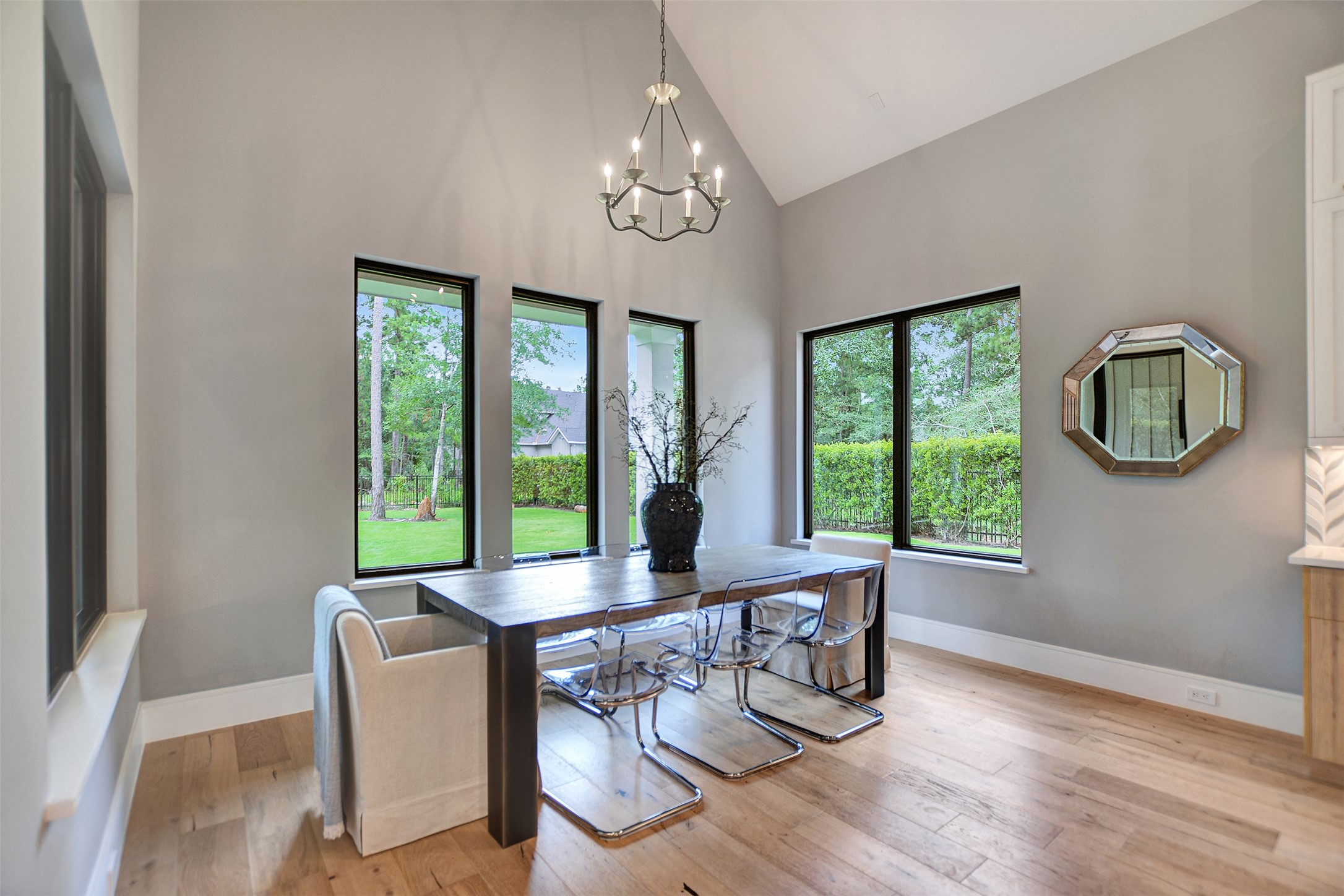 411 Copa Palm Loop Montgomery, TX 77316 - Photo 19 of 46 a dining room with chandelier and wooden floor