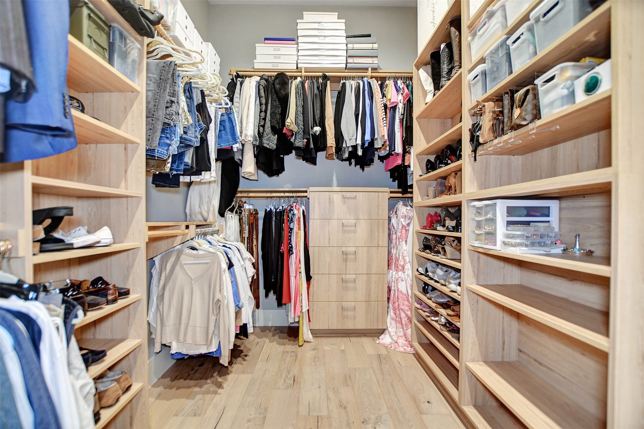 411 Copa Palm Loop Montgomery, TX 77316 - Photo 29 of 46 a view of walk in closet with clothes and shoes