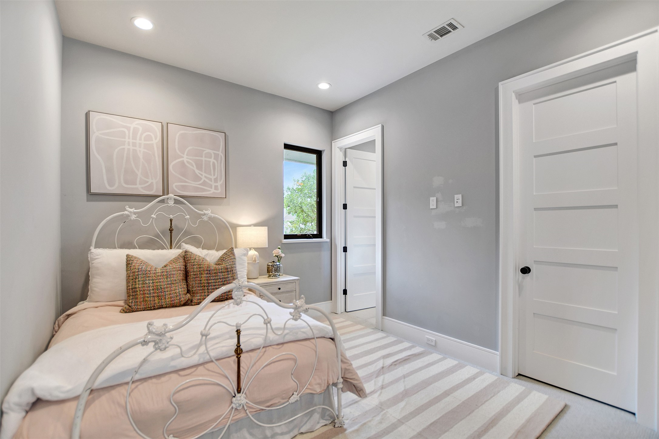 411 Copa Palm Loop Montgomery, TX 77316 - Photo 36 of 46 a bedroom with a bed and a window