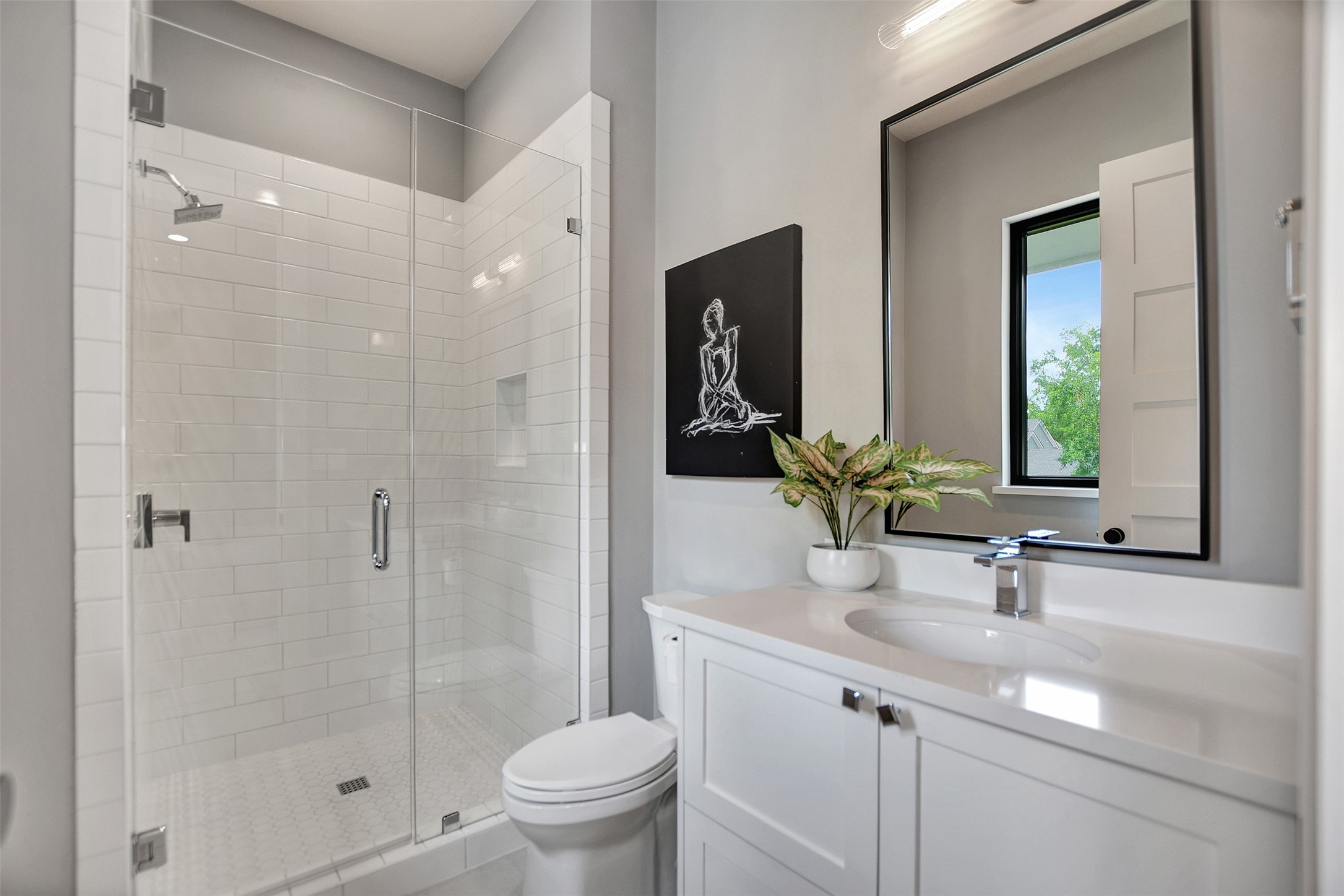 411 Copa Palm Loop Montgomery, TX 77316 - Photo 37 of 46 a bathroom with a sink a toilet and shower