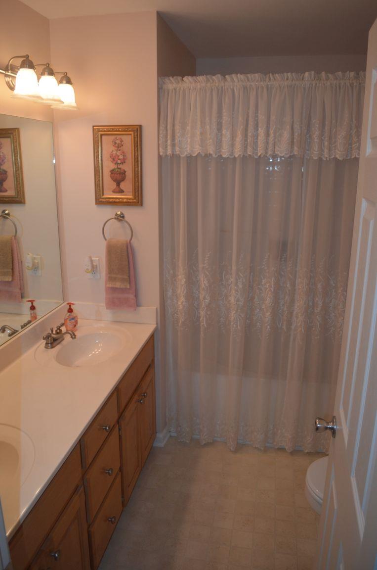 2790 Woods Road Springfield, TN 37172 - Photo 14 of 30 a bathroom with a double vanity sink and a mirror