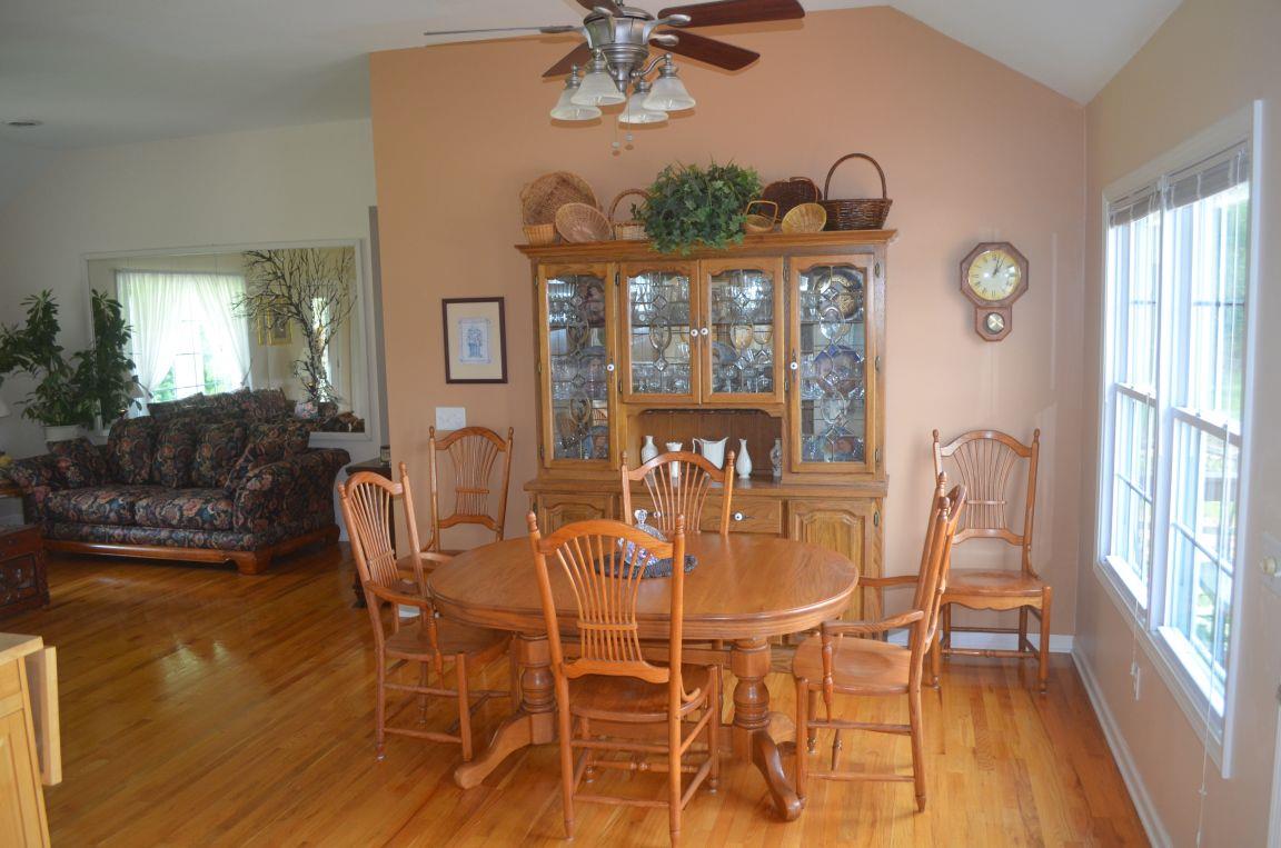 2790 Woods Road Springfield, TN 37172 - Photo 7 of 30 a view of a dining room with furniture window and wooden floor