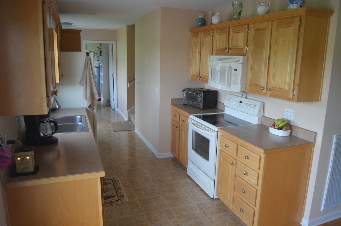 2790 Woods Road Springfield, TN 37172 - Photo 8 of 30 a kitchen with sink a stove and refrigerator