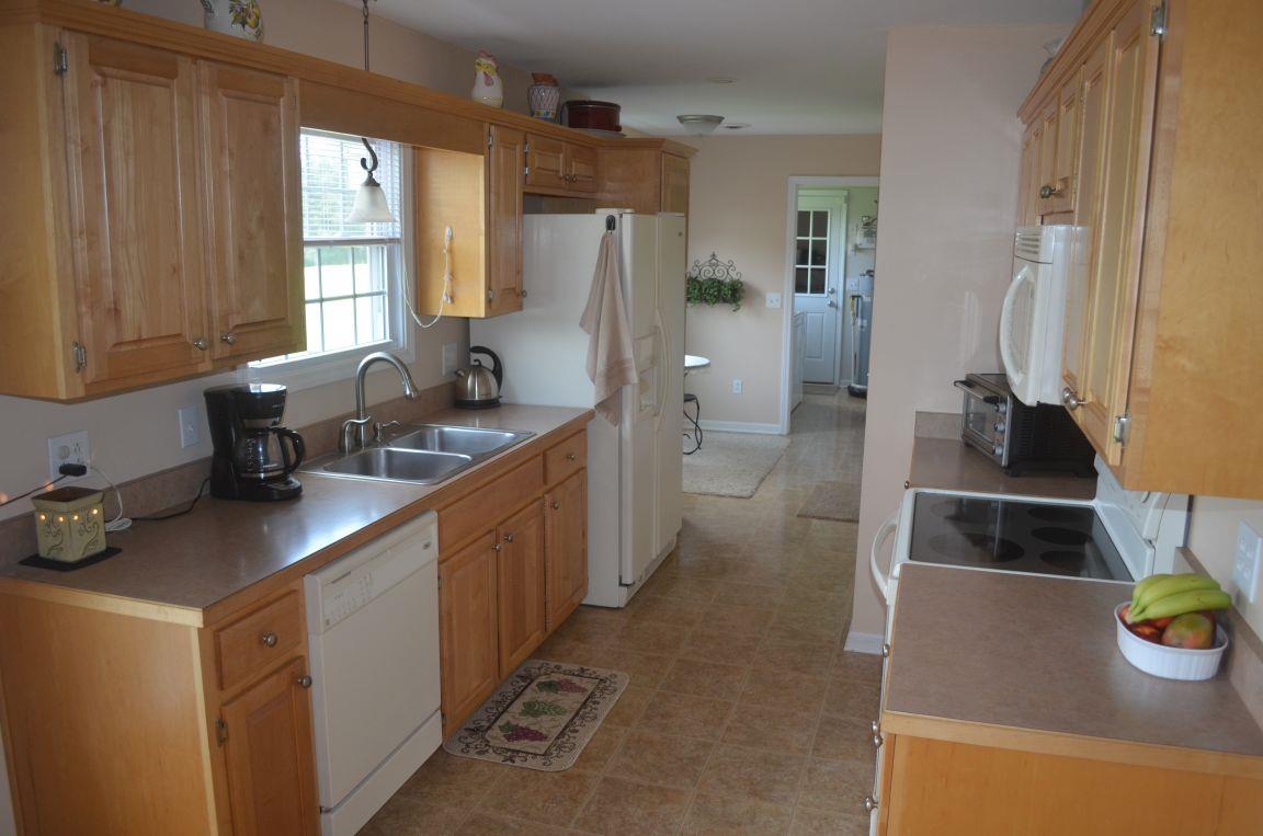 2790 Woods Road Springfield, TN 37172 - Photo 9 of 30 a kitchen with sink a stove and cabinets