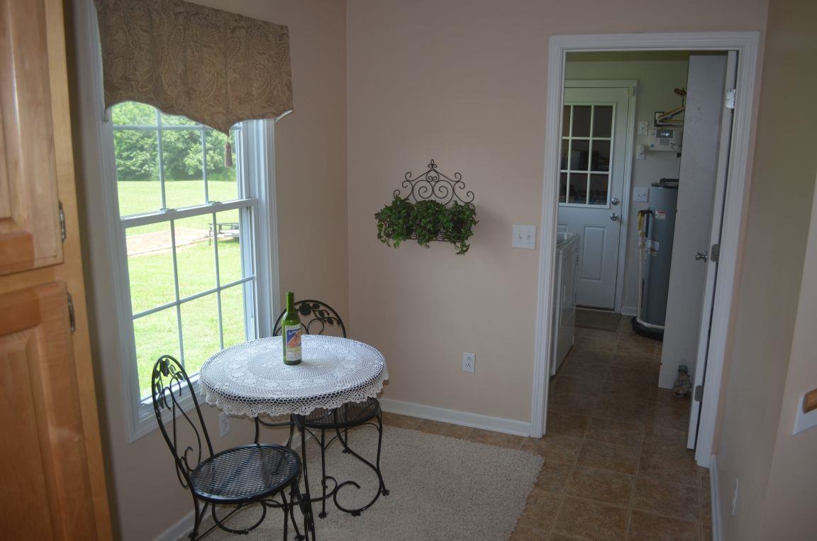 2790 Woods Road Springfield, TN 37172 - Photo 10 of 30 a view of a room that has a table and a chair in it