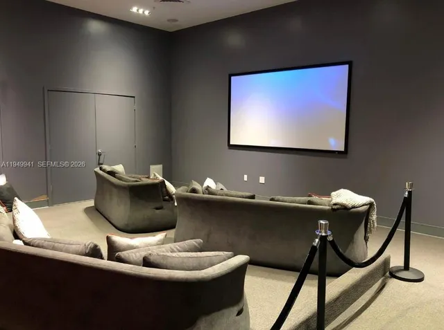 a view of a living room and kitchen