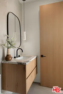 a close view of light fixtures and potted plants on a table